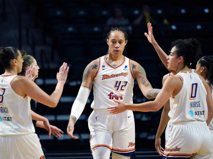 Phoenix Mercury’s Brittney Griner is congratulated by teammates in a game from 2021.